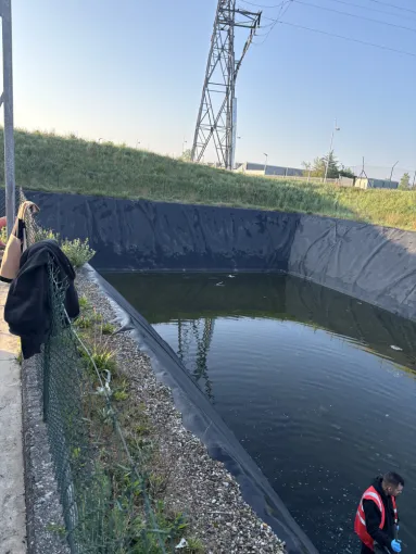 nettoyage d un bassin eaux pluviales dans une entreprise à Pont Evèque