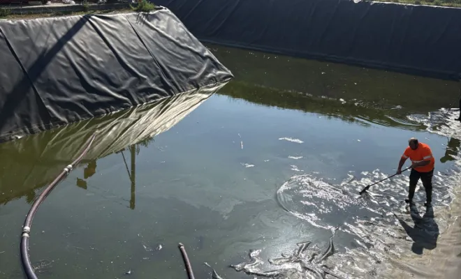 nettoyage d un bassin eaux pluviales dans une entreprise à Pont Evèque