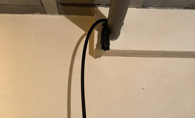 Débouchage d'une canalisation suspendue en sous-sol à Saint Laurent de Mure, Vaulx-Milieu, JP ASSAINISSEMENT