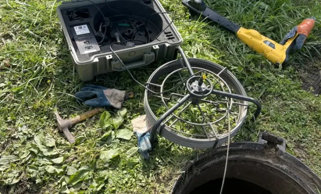 Pompage d'un regard d'eau potable et inspection video pour localisation d'une fuite importante dans une concession automobile à Bourgoin, Vaulx-Milieu, JP ASSAINISSEMENT