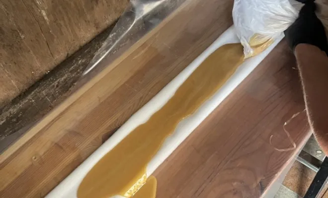 Réparation de réseau eu manchette résine dans un bâtiment pour une agence immobilière à Morestel, Vaulx-Milieu, JP ASSAINISSEMENT