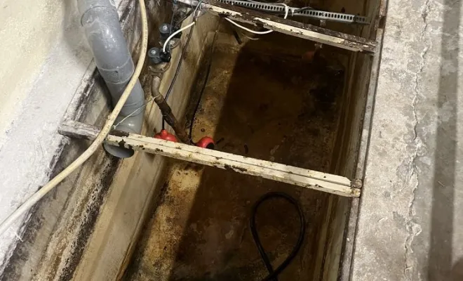 Vidange d'une petite fosse de décantation machine dans une entreprise à Saint Bonnet de Mure, Vaulx-Milieu, JP ASSAINISSEMENT