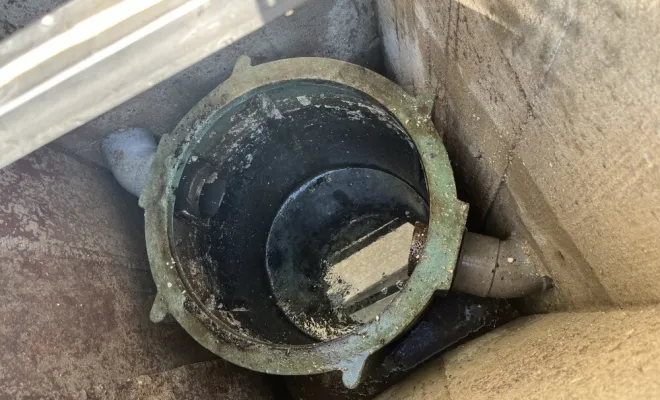 Vidange et nettoyage d'un bac dégraisseur chez un particulier pour entretien à Marenne, Vaulx-Milieu, JP ASSAINISSEMENT