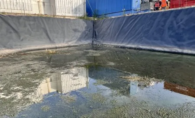 Vidange et nettoyage d'un bassin de décantation dans une entreprise à Pont Evèque, Vaulx-Milieu, JP ASSAINISSEMENT