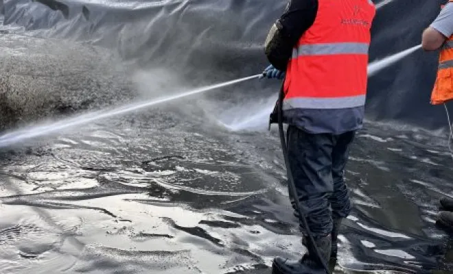 Vidange et nettoyage d'un bassin de décantation dans une entreprise à Pont Evèque, Vaulx-Milieu, JP ASSAINISSEMENT