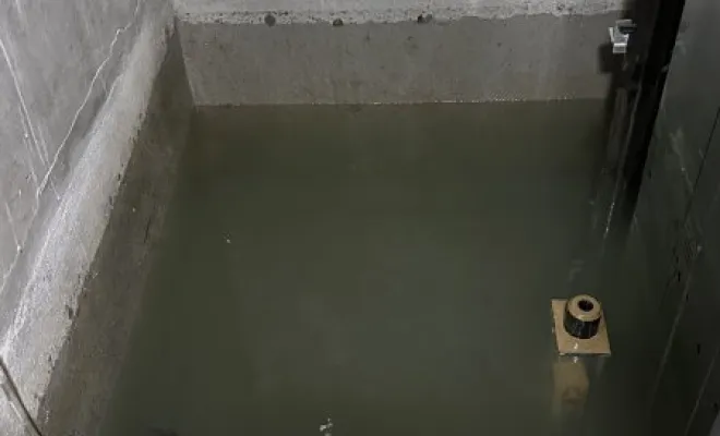 Vidange et nettoyage d'une cage ascenseur suite a une inondation à Saint Georges d'Esperanche, Vaulx-Milieu, JP ASSAINISSEMENT