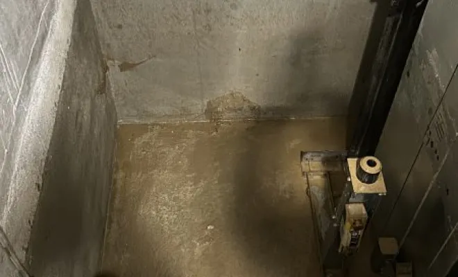 Vidange et nettoyage d'une cage ascenseur suite a une inondation à Saint Georges d'Esperanche, Vaulx-Milieu, JP ASSAINISSEMENT